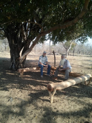 Bro Jaco and bro Pieter sitting at a resting place at Amana entrance.